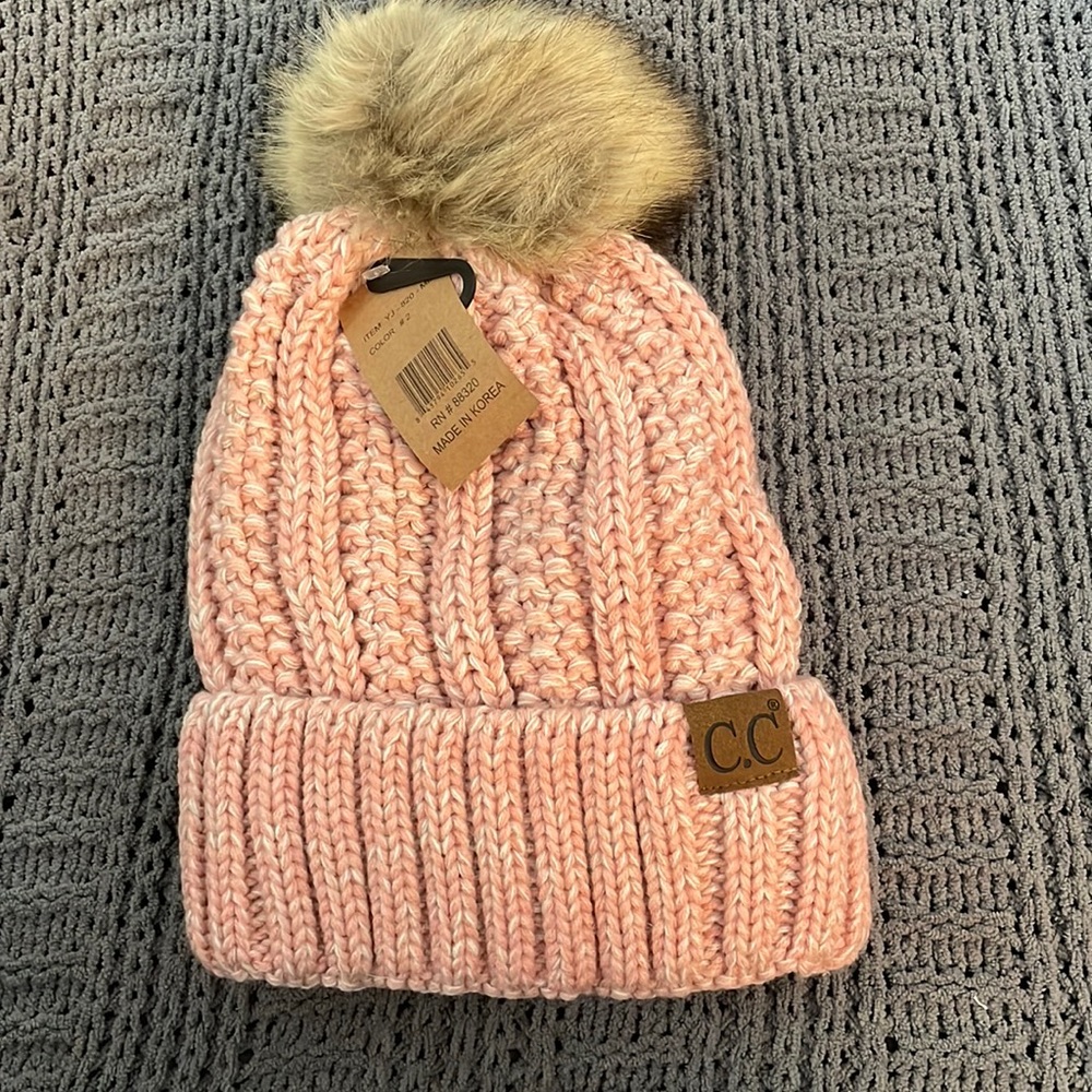 C.C Pom-pom hat. Blush/cream color. Soft lining. New with tags.